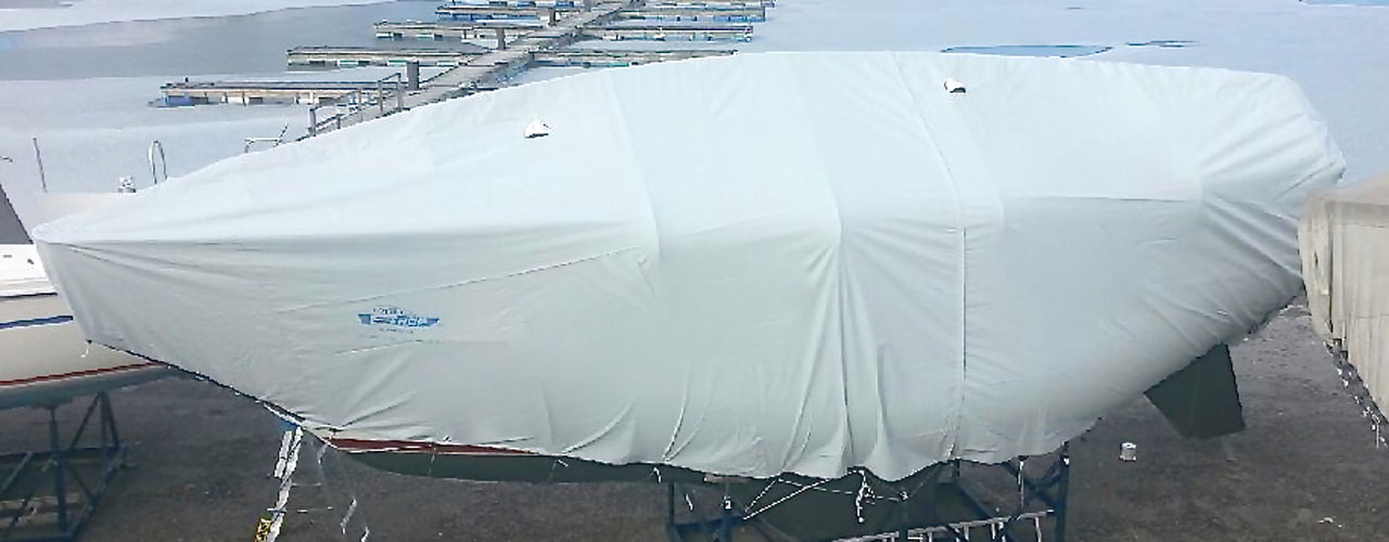 How do you put a canvas cover on your sailboat?